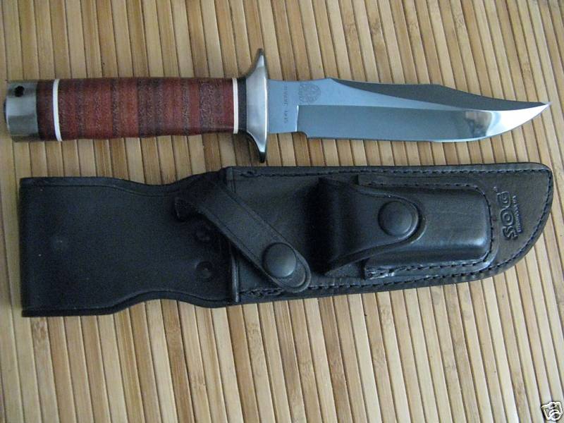 SOG S1 with leather sheath (pouch contains sharpening stone)