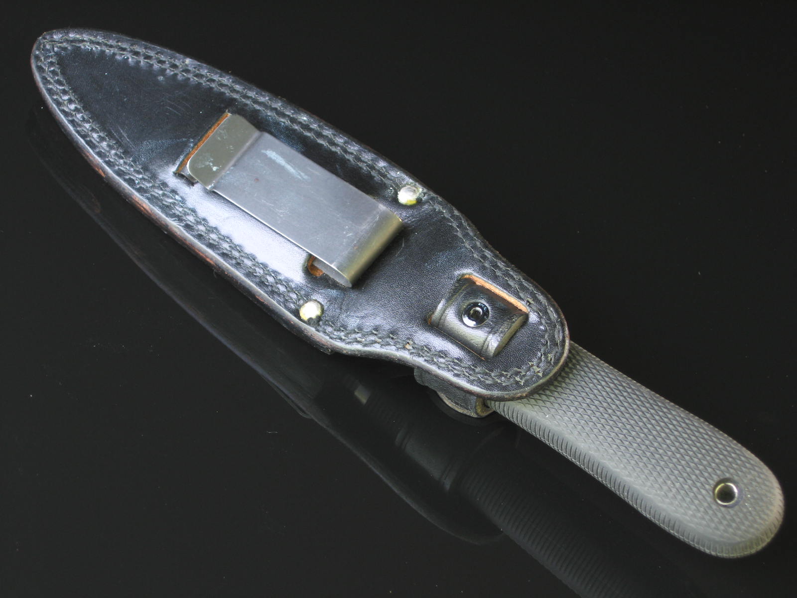 SOG Pentagon in older leather sheath back retaining clip...  Dagger (Photo: Arthur Margain)